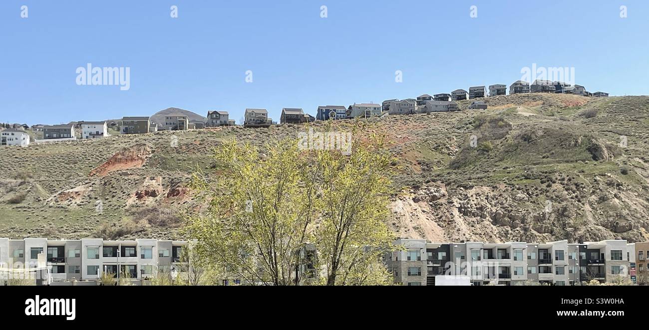 A row of new homes built along a mountain ledge in Utah, USA. - Smartphone Captured Stock Image