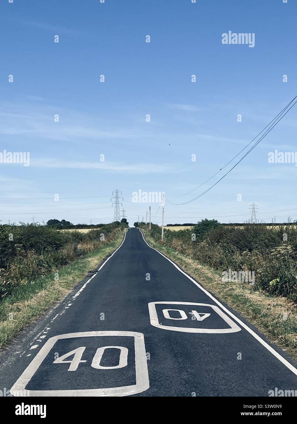 Diminishing perspective on an empty road Stock Photo