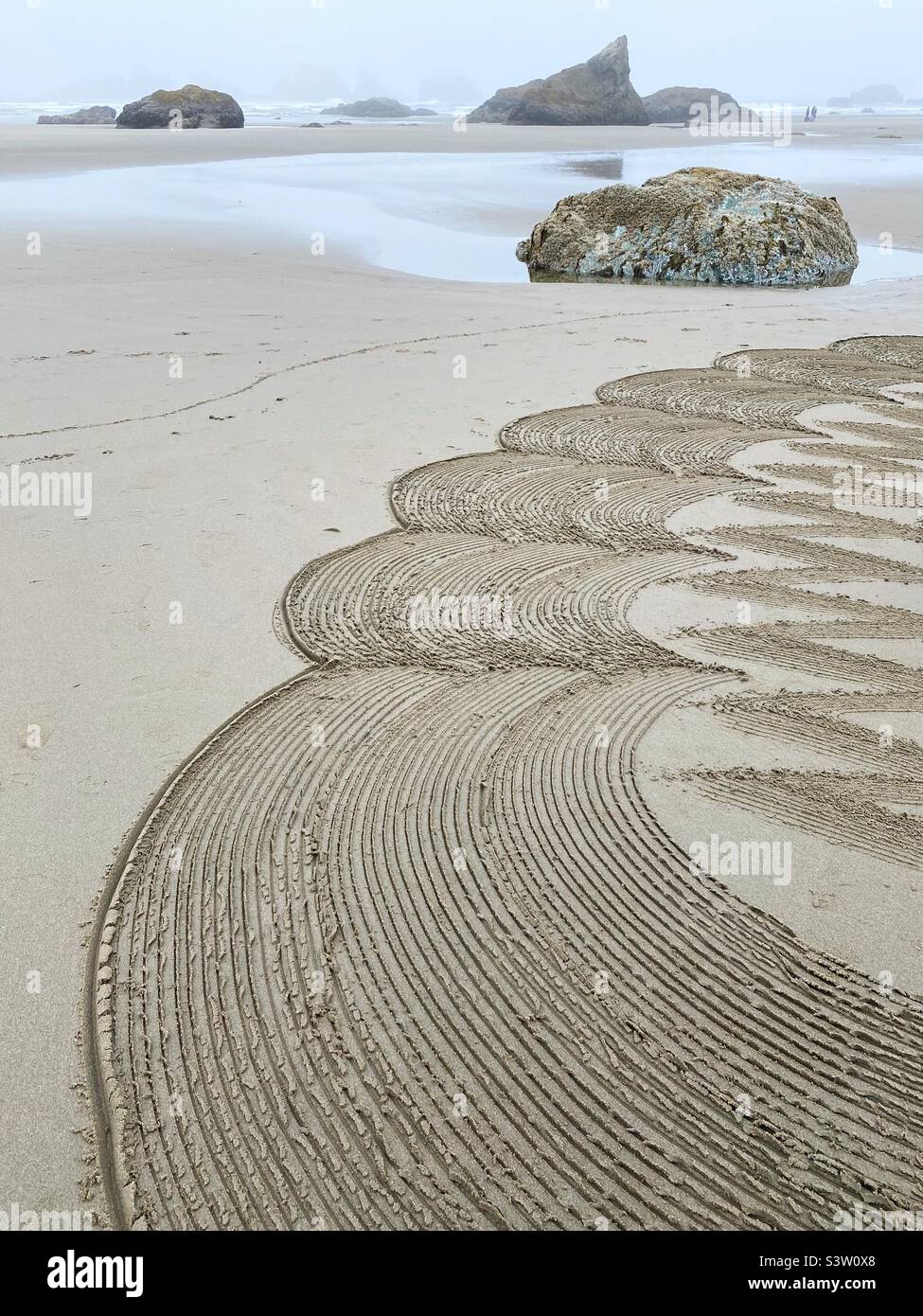 A section of a sand labyrinth on face rock beach in Bandon, oregon. Stock Photo