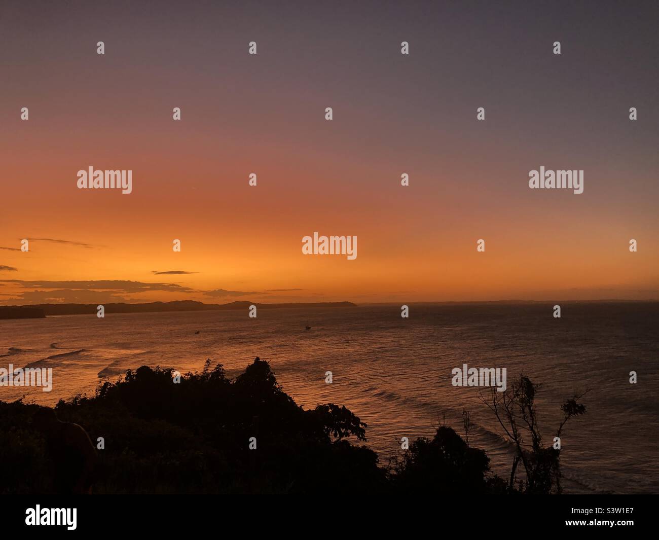 Orange sunset over the sea in northern Brazil. - Smartphone Captured Stock Image