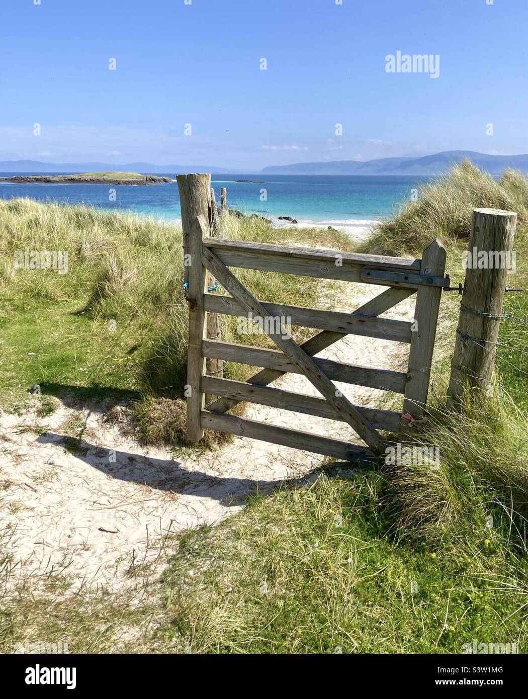 Wooden gate leading to the beach, Isle of Iona Stock Photo
