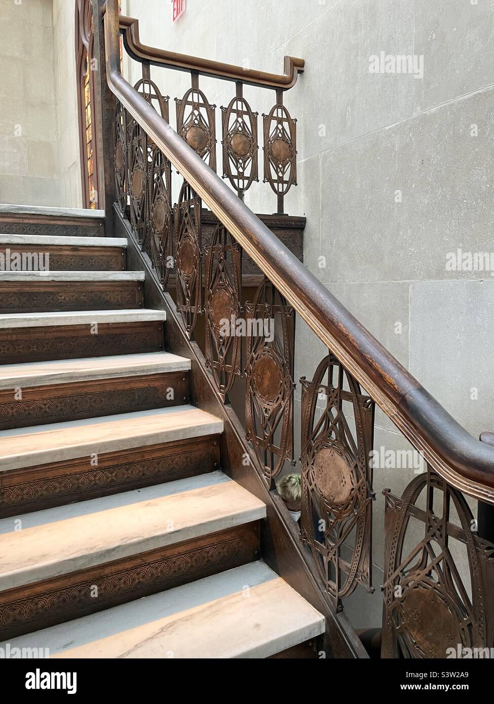Magnificent wooden carved Tiffany staircase within the metropolitan Museum of art in New York City - Smartphone Captured Stock Image
