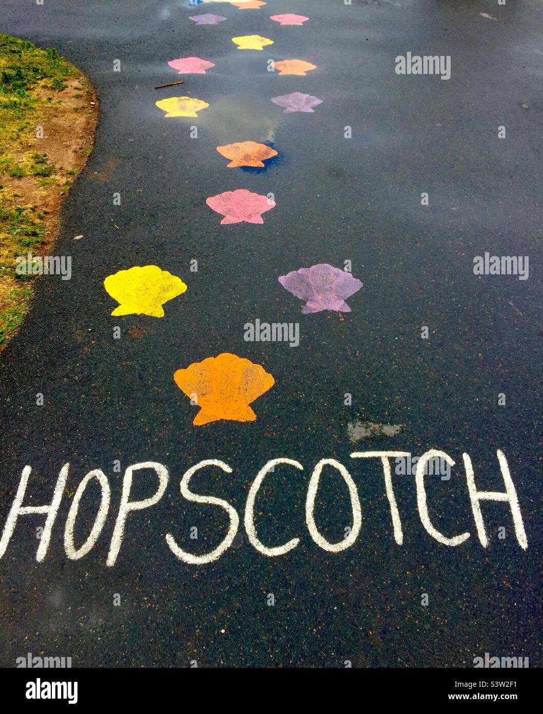 Unusual hopscotch, with seashells, on the Boardwalk, Halifax, Canada. Reflecting geography. No numbers. Stock Photo