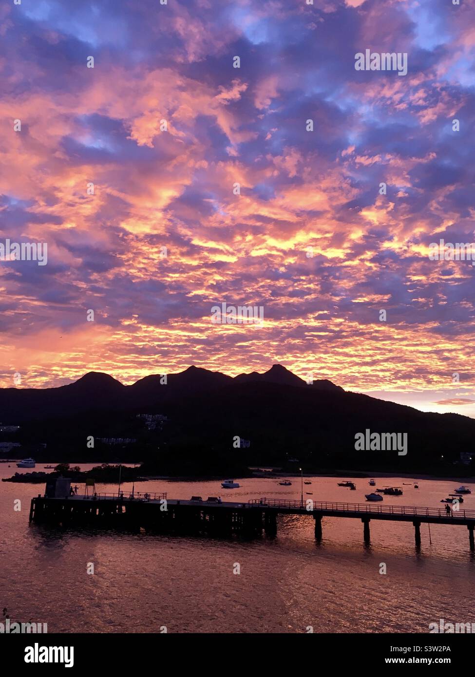 Sunset over Ma On Shan, Sai Kung, Hong Kong Stock Photo