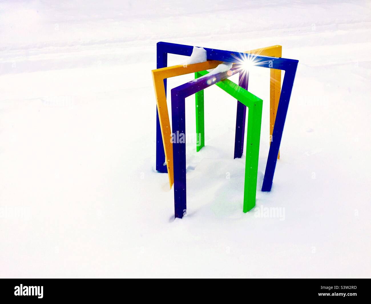 Squares in snow.  Bike stands shaped like hurdles make a colorful geometric pattern in the middle of winter, Ontario, Canada. - Smartphone Captured Stock Image