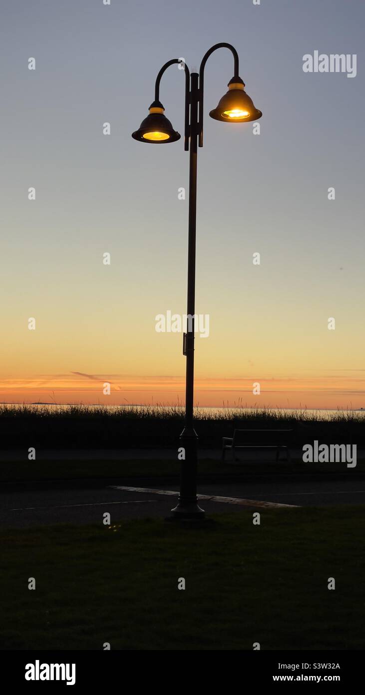 Glowing Sunset Lamp Post Stock Photo Alamy