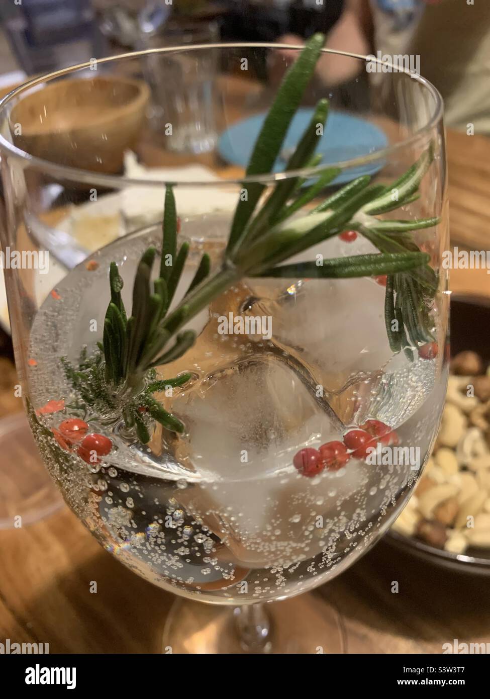 Gin & Tonic with Rosemary and red pepper Stock Photo Alamy