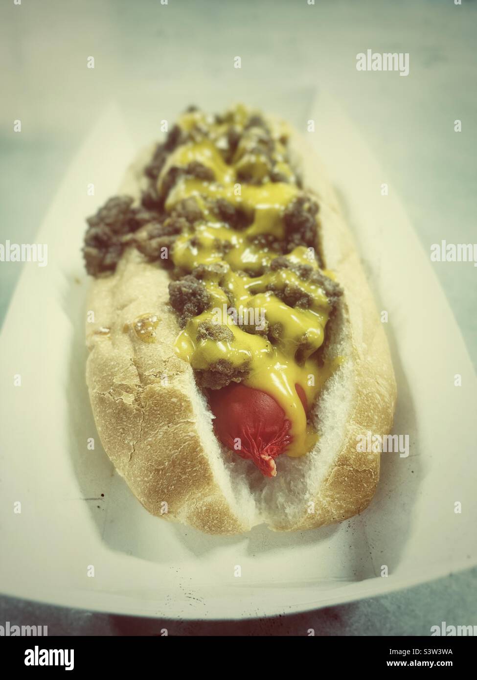 Hot-dog sausage with minced beef and cheese sauce with retro effect - Smartphone Captured Stock Image