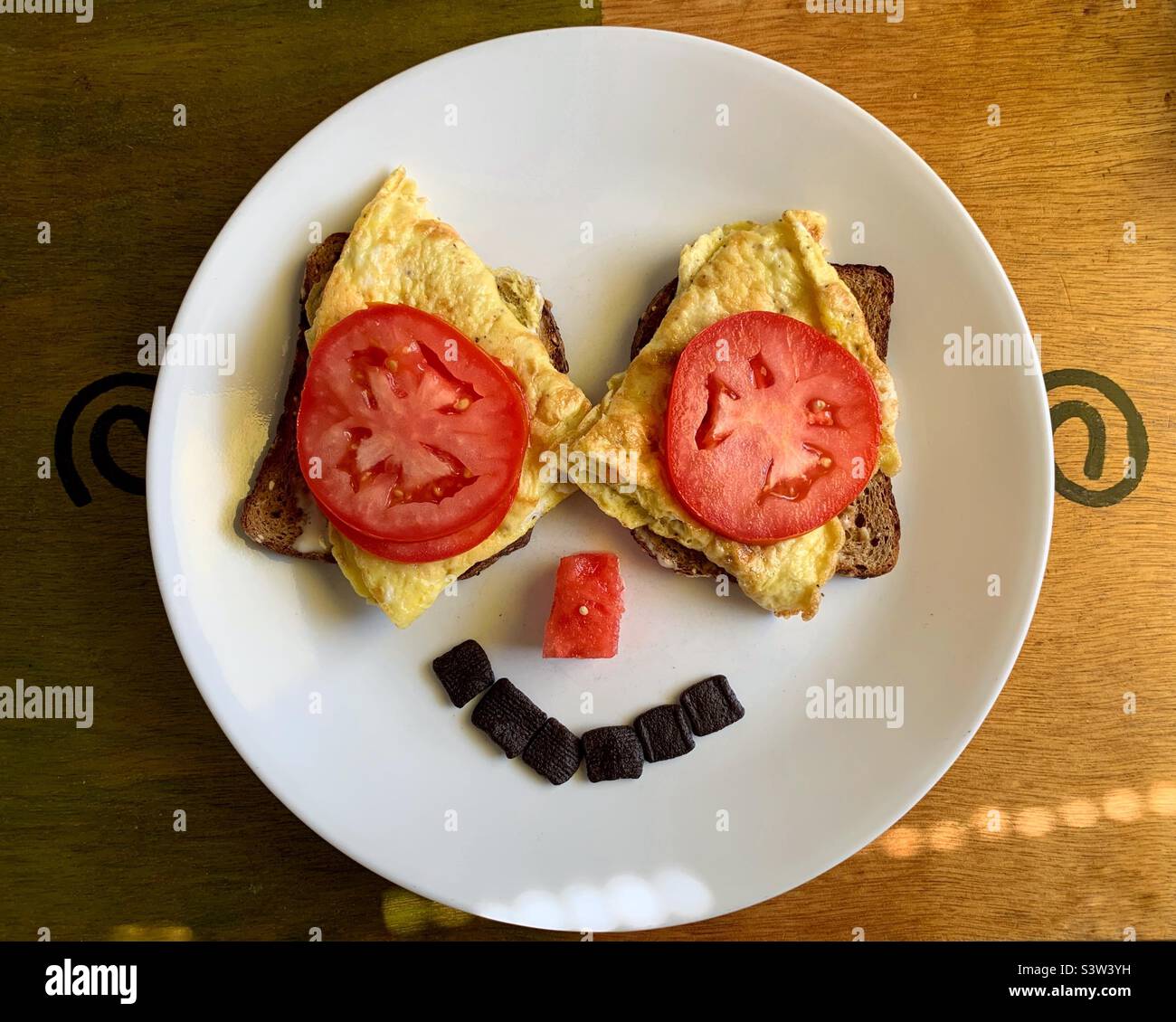 Smiley breakfast on white plate - Smartphone Captured Stock Image
