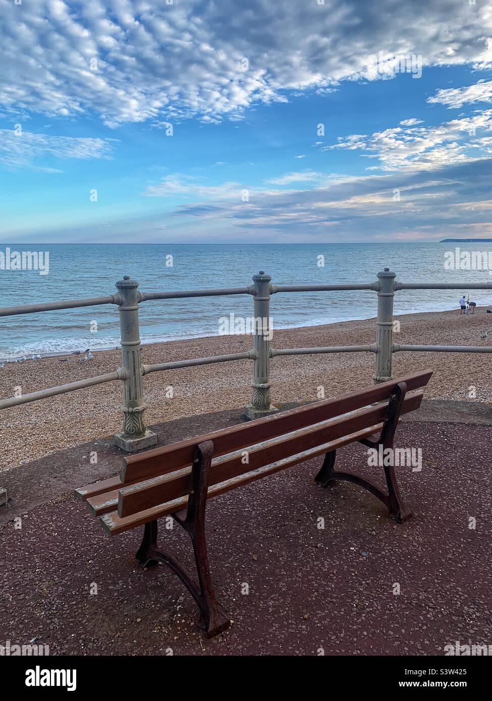Bench on Hastings beach England Stock Photo