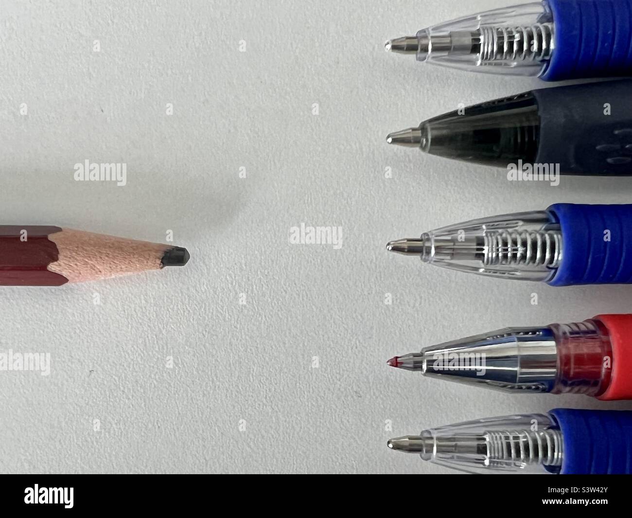 Pencil vs pens Stock Photo Alamy