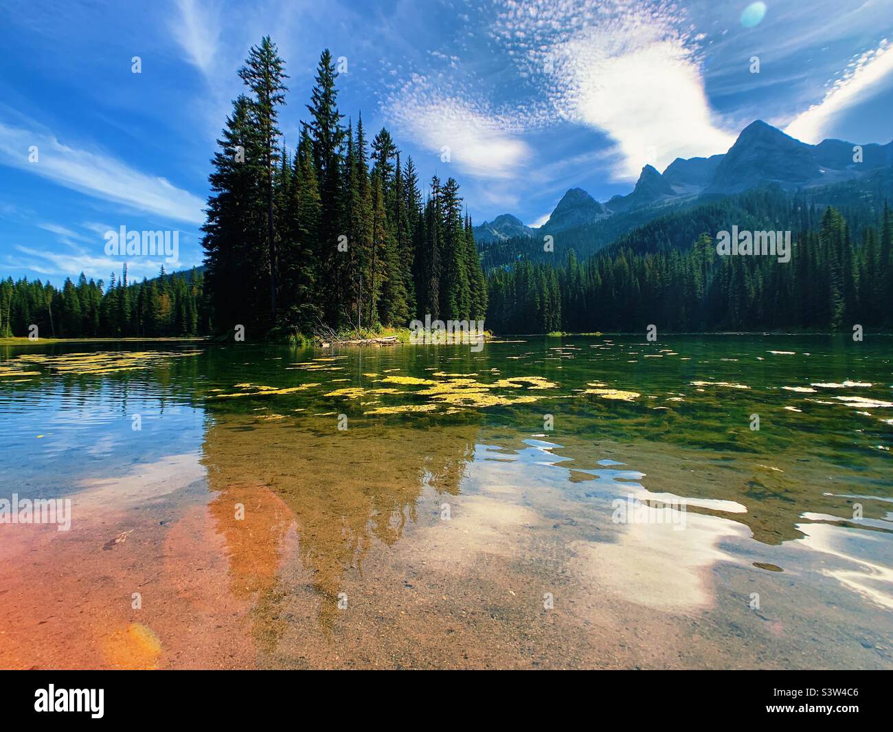 A beautiful mountain lake in the middle of summer. Stock Photo