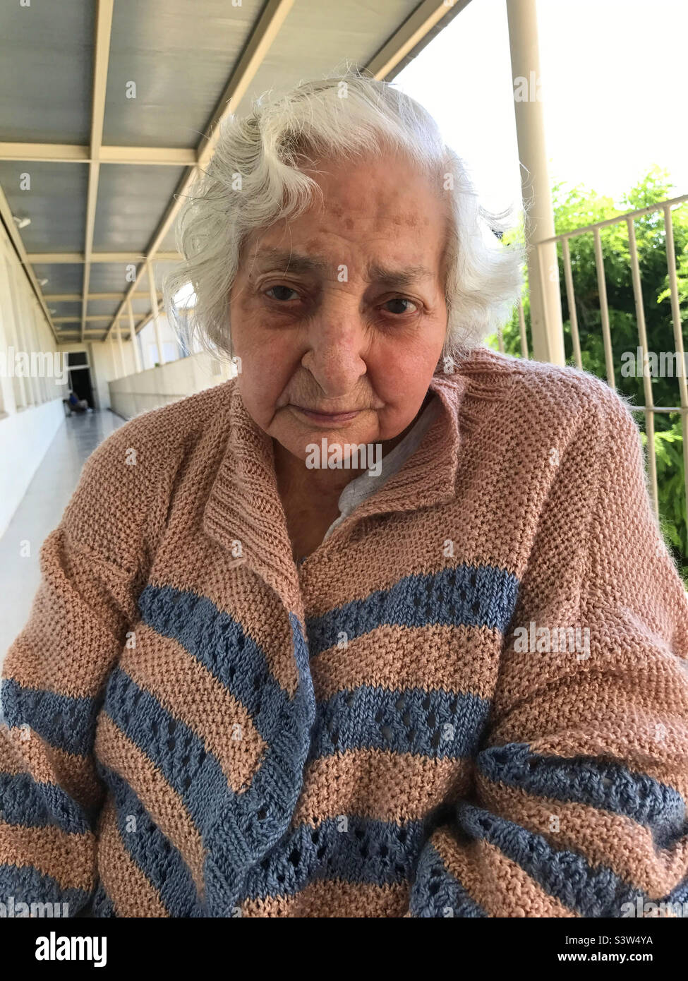 Portrait of old lady in a nursing home - Smartphone Captured Stock Image