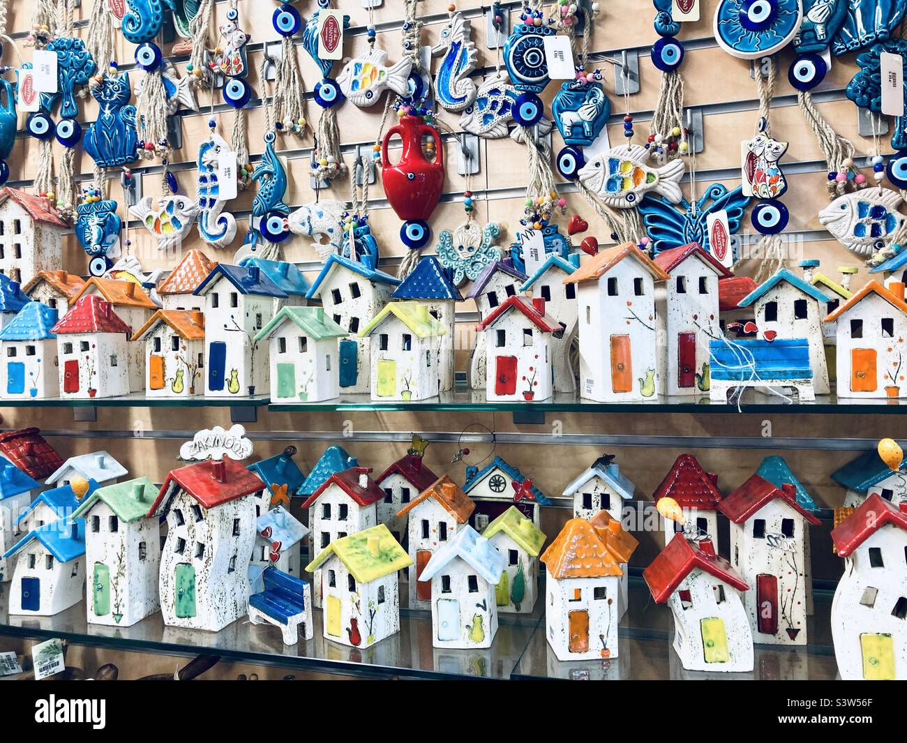 Greek tourist shop with houses on sale Stock Photo