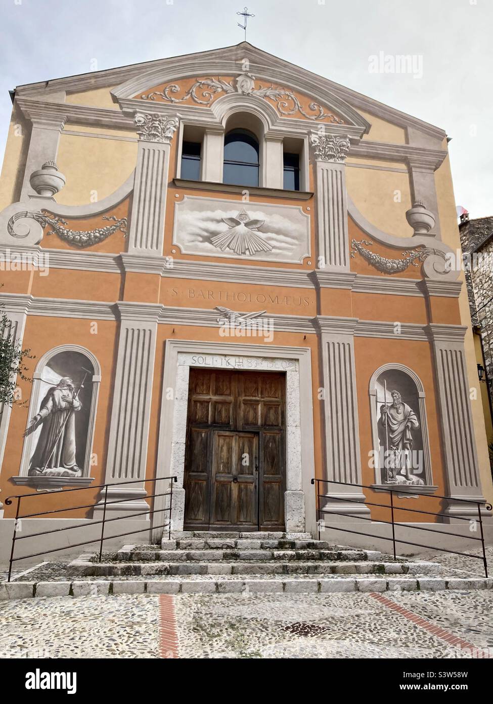 Saint Bartholomée/Saint Bartholomew church in Gorbio France. A 17th-century church with trompe-l’œil paintings on its facade. - Smartphone Captured Stock Image