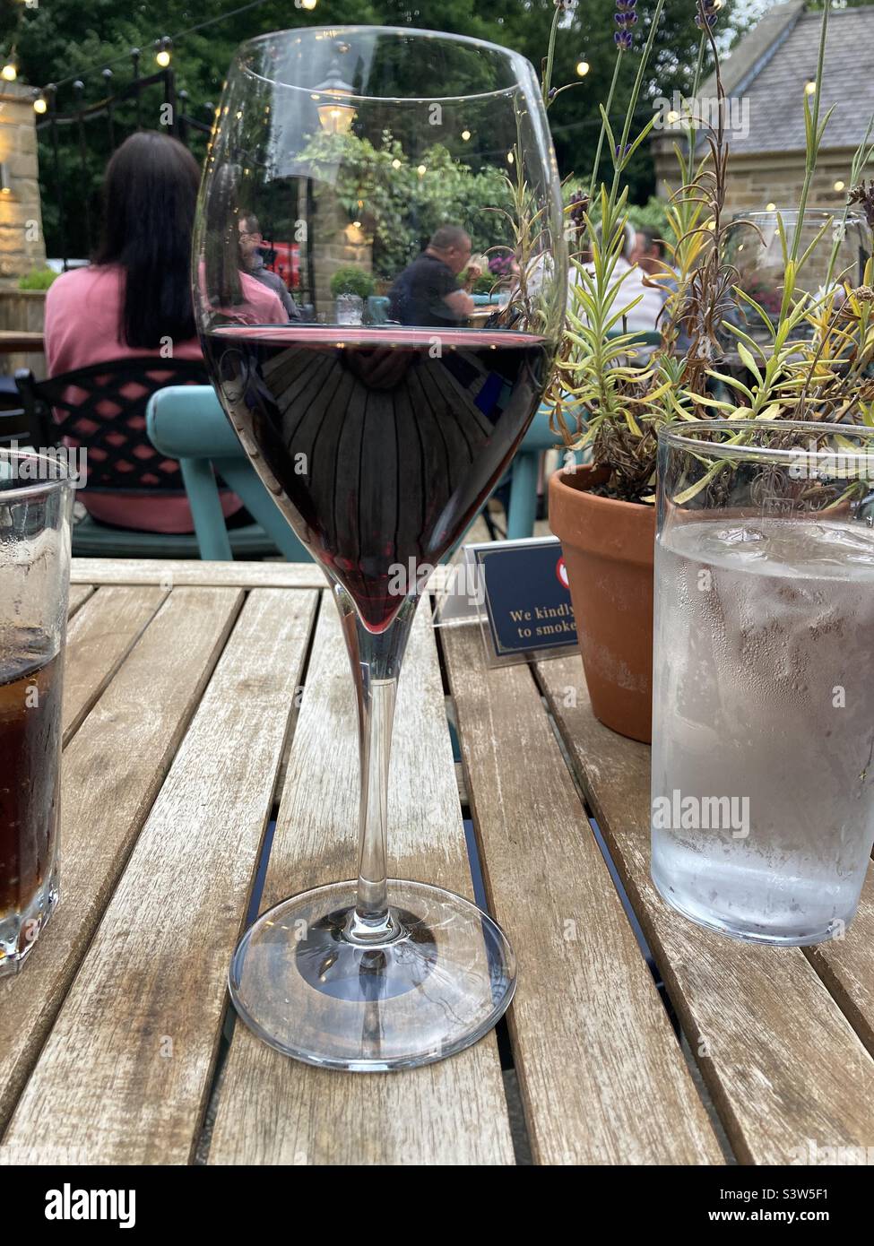 Glass of Red wine in the beer garden - Smartphone Captured Stock Image