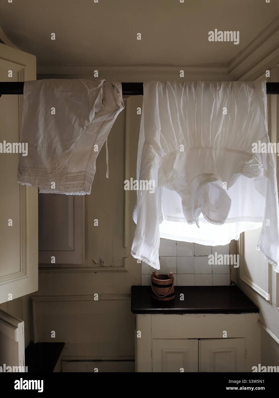 old style linen hanging to dry in period laundry room Stock Photo