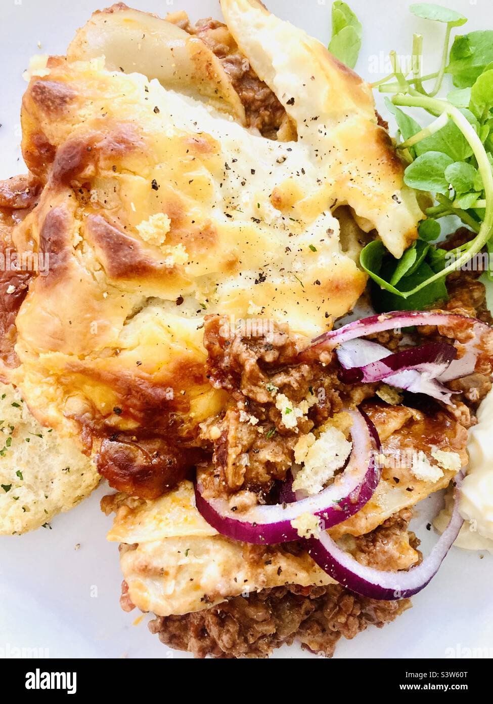 Beef lasagna with salad Stock Photo Alamy