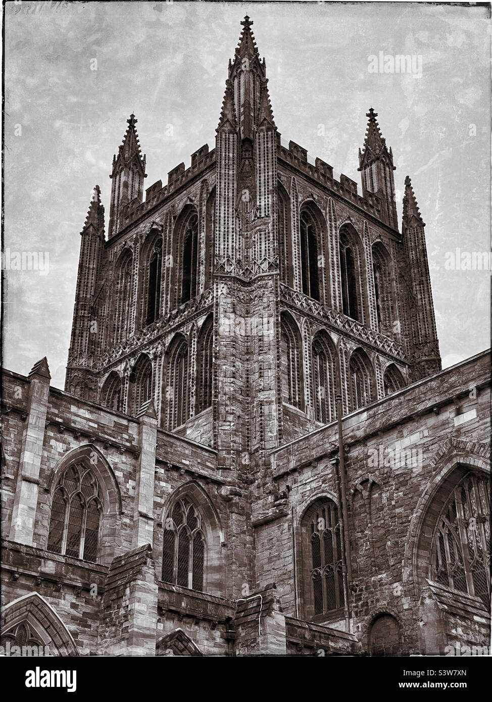 A grunge effect image of the Tower of Hereford Cathedral. This Gothic Anglican Cathedral is home to the priceless UNESCO listed Mappa Mundi medieval map. Photo ©️ COLIN HOSKINS. - Smartphone Captured Stock Image