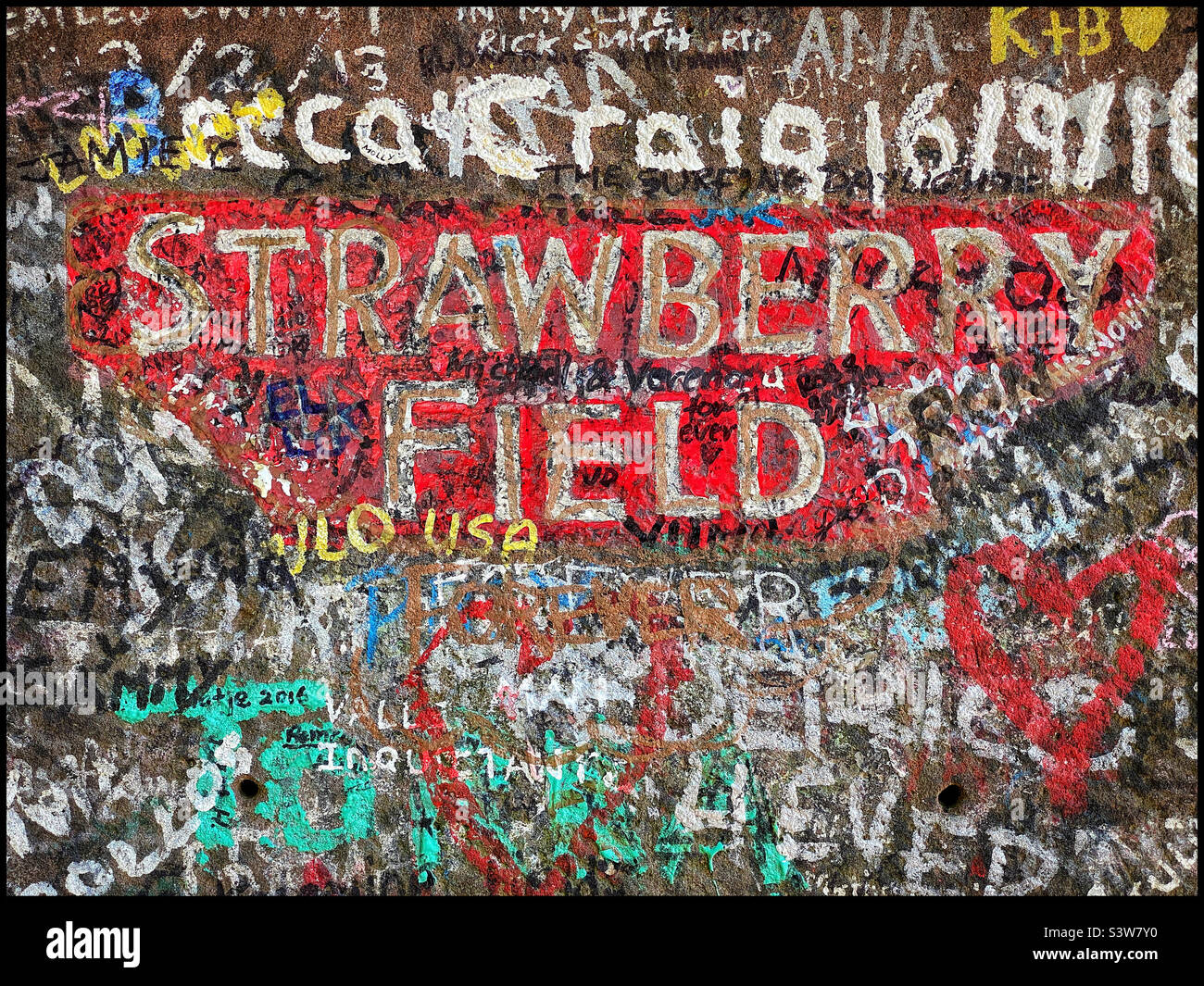 “Let me take you down, nothing is real, And nothing to get hung about, Strawberry Fields forever” Graffiti on the gateposts to the childhood area where John Lennon used to play. Photo ©️ COLIN HOSKINS Stock Photo