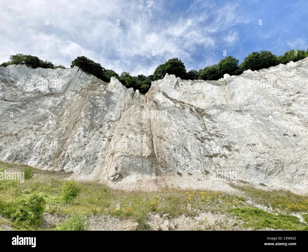 The White chalk cliffs of Mons Clint Pictured from below Stock Photo