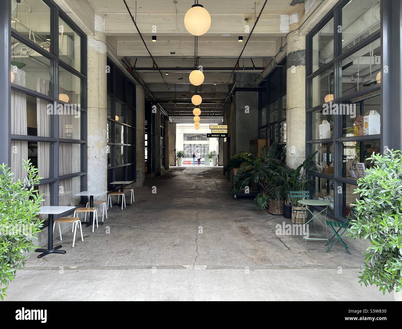 LOS ANGELES, CA, APR 2022: passage through building at The Row, redeveloped industrial buildings now used as a creative, light manufacturing,  and retail area in Produce District, Downtown - Smartphone Captured Stock Image