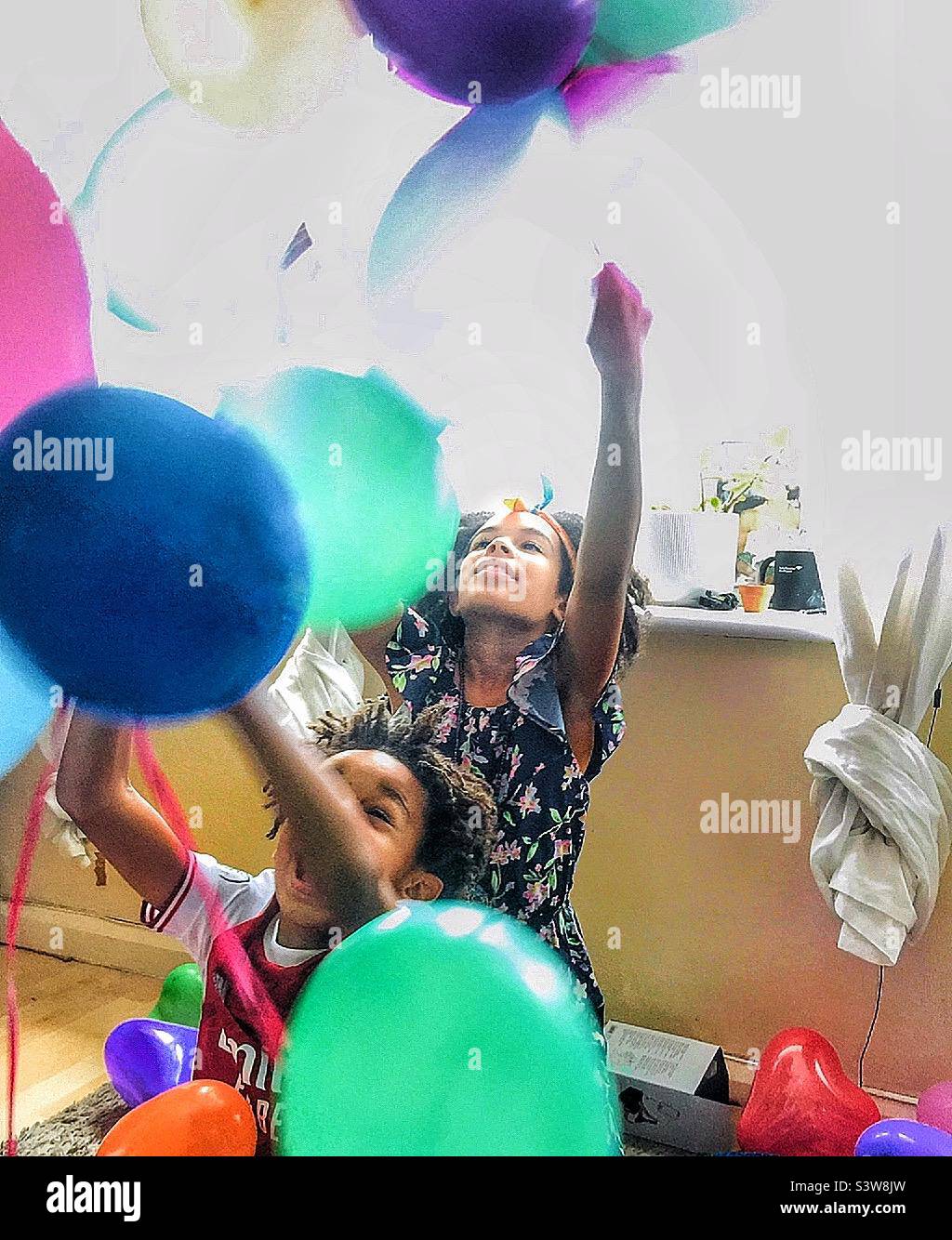 Kids playing with balloons. Stock Photo