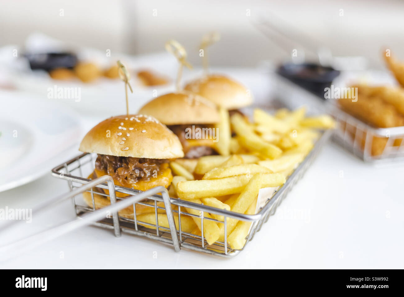 Mini burgers with French fries, snack at the bar Stock Photo