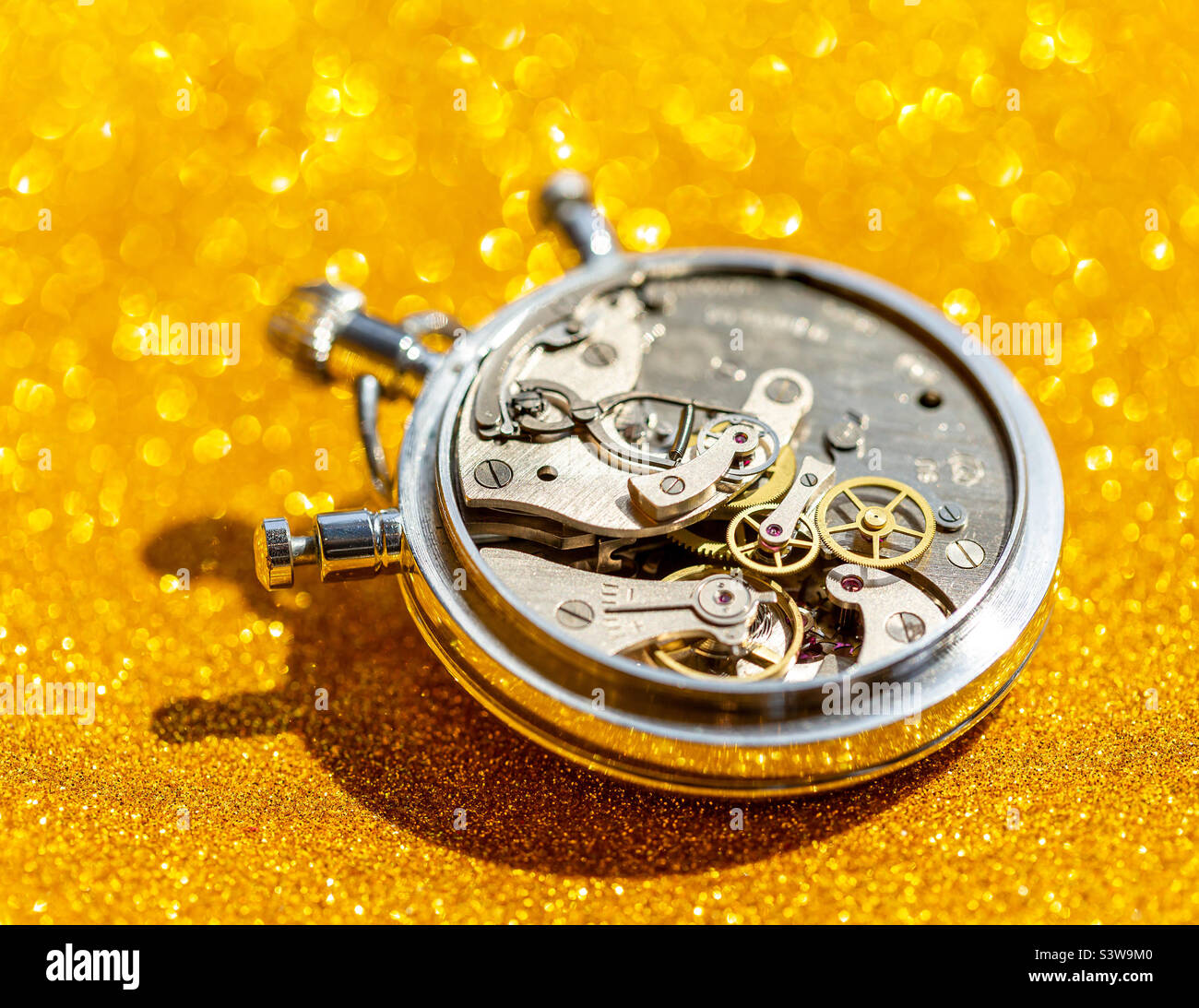 An old countdown timer opened up showing all the details of the mechanism, macro closeup - Smartphone Captured Stock Image