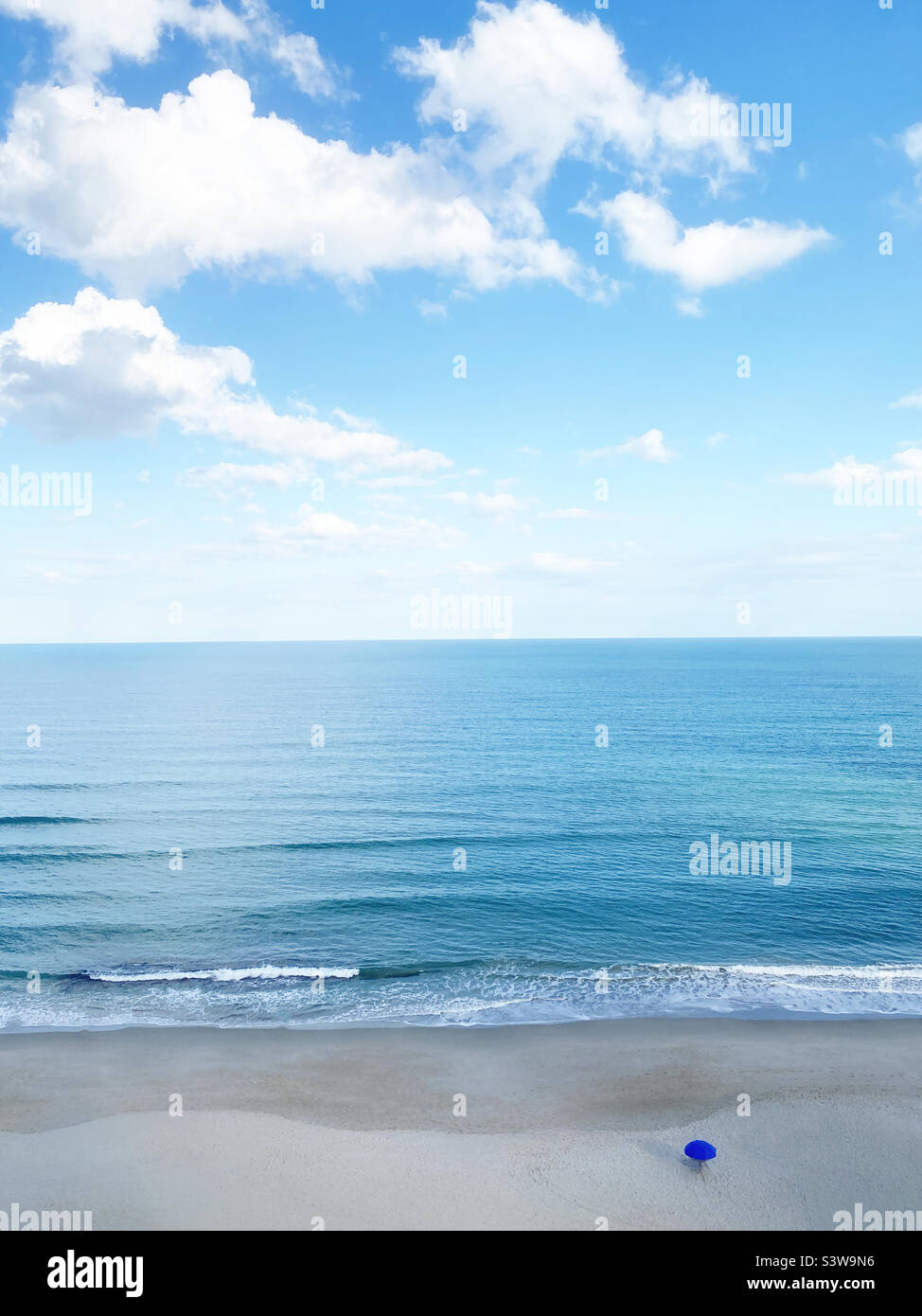 Single umbrella on beach - Smartphone Captured Stock Image