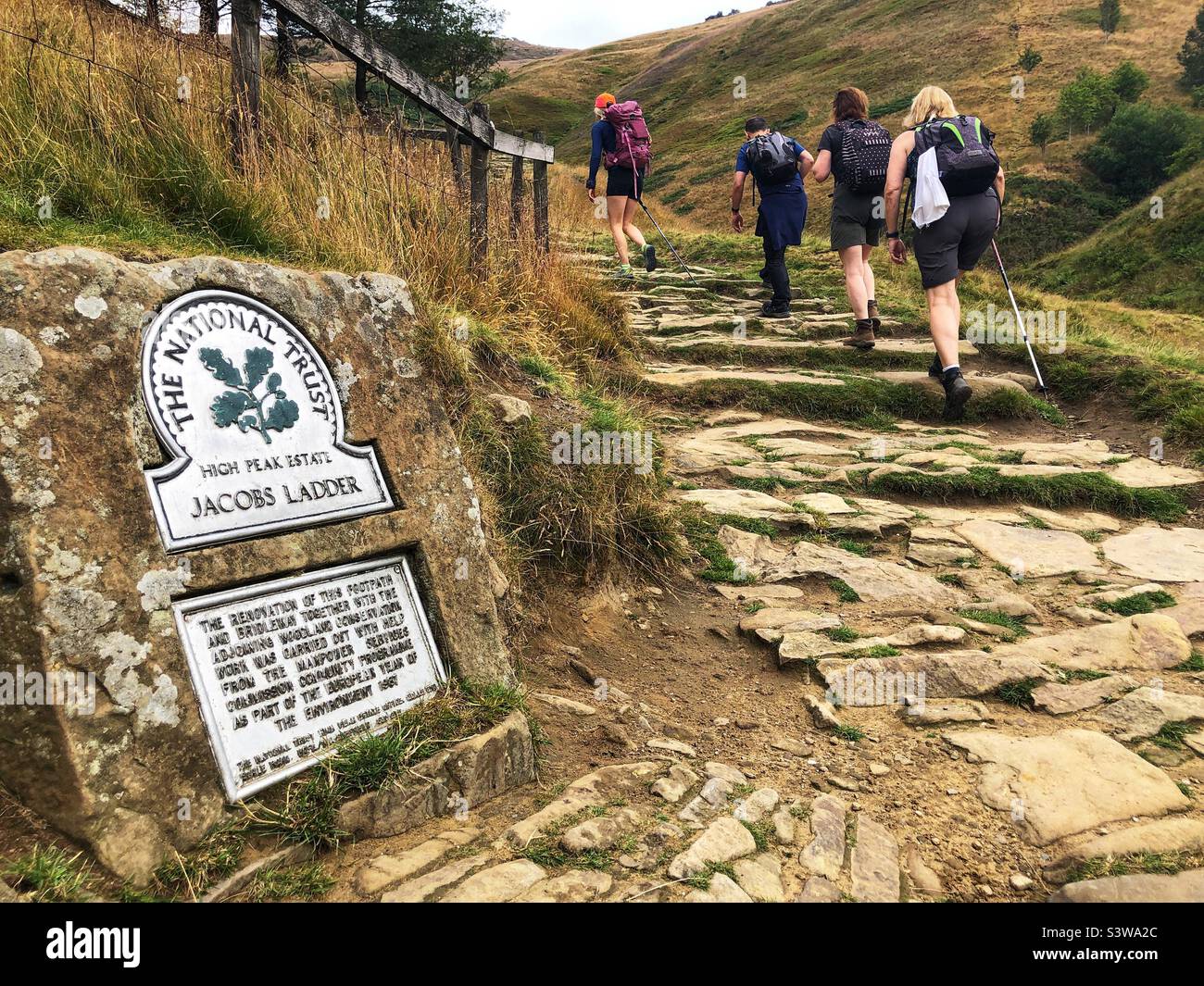 Walkers start the ascent of Jacobs ladder on the way to Kinder Scout ridge, Peak District National Park, England Stock Photo