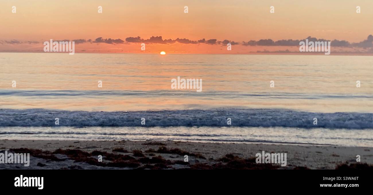 Glorious sunrise over the Atlantic ocean in Florida. With beautiful colors - Smartphone Captured Stock Image