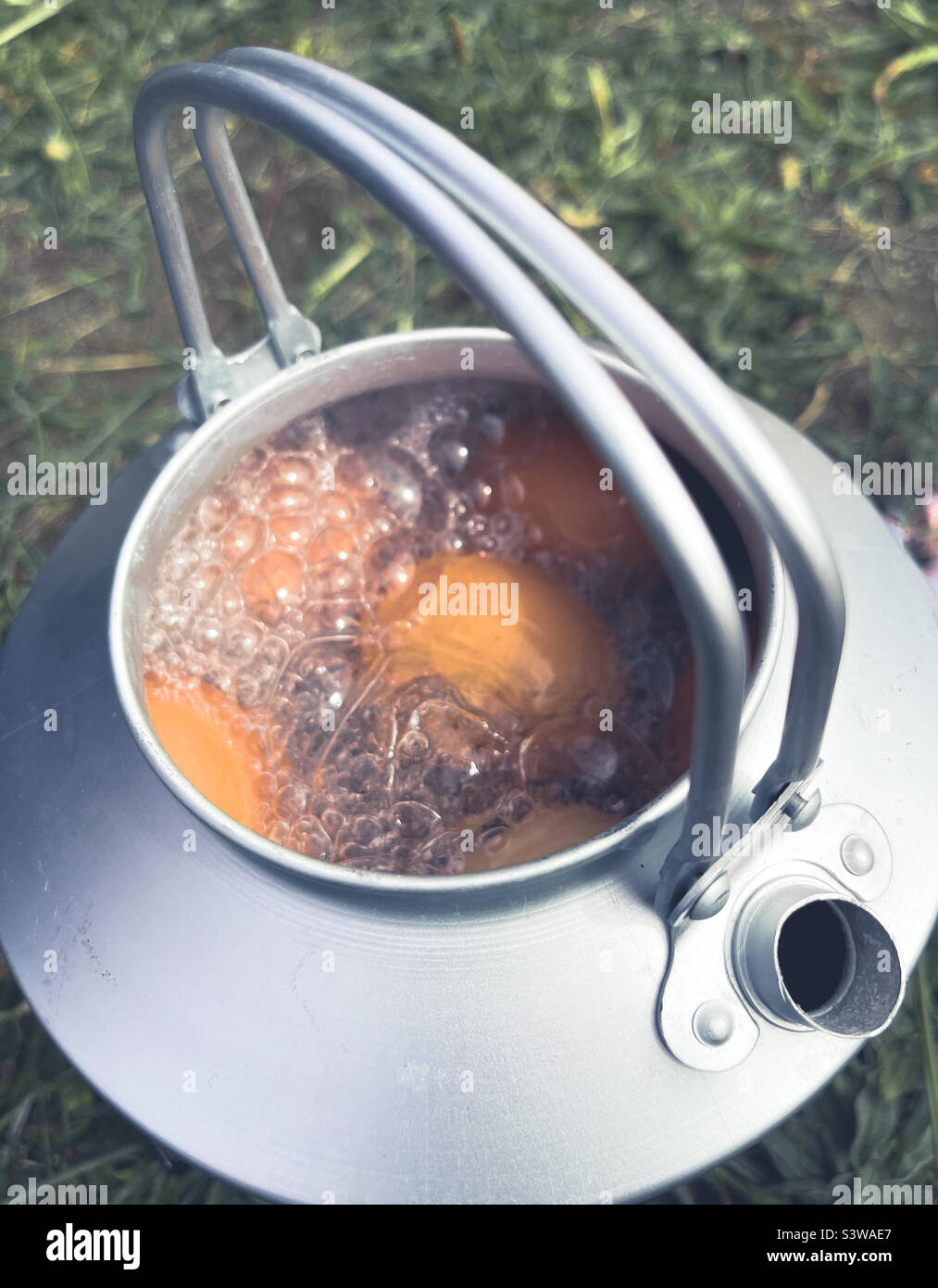 Boiling eggs in a camp kettle - Smartphone Captured Stock Image
