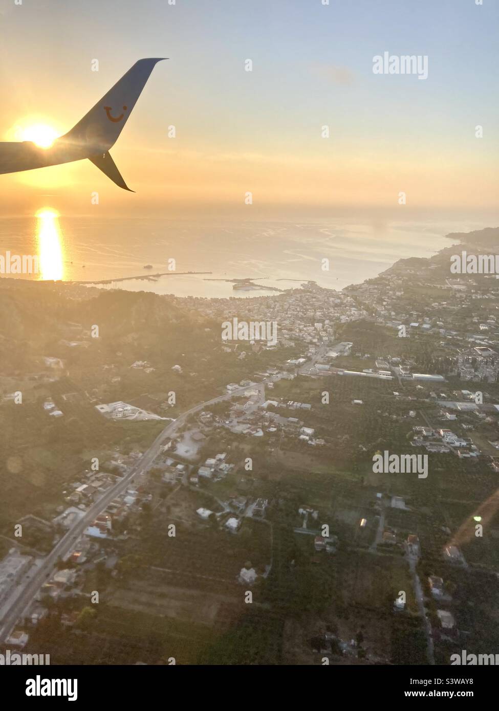 View from plane window looking down at Zakynthos Greece Stock Photo