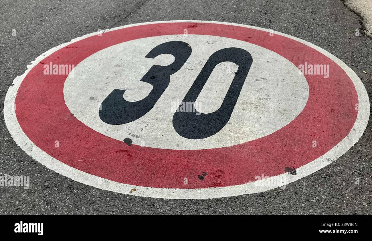 Speed limit indicator painted on the street. - Smartphone Captured Stock Image