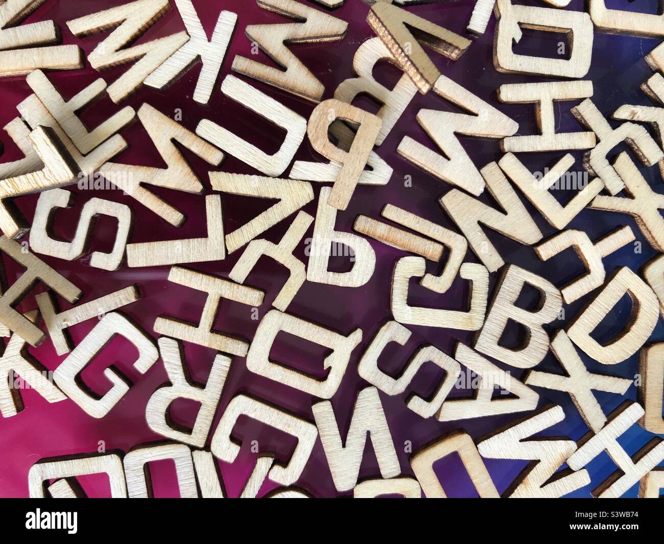 Wooden letters scrambled Stock Photo