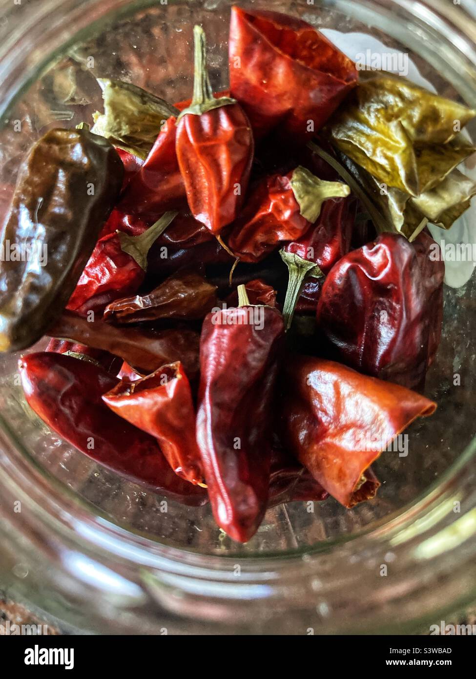 A Glass of dried chili Peppers Stock Photo