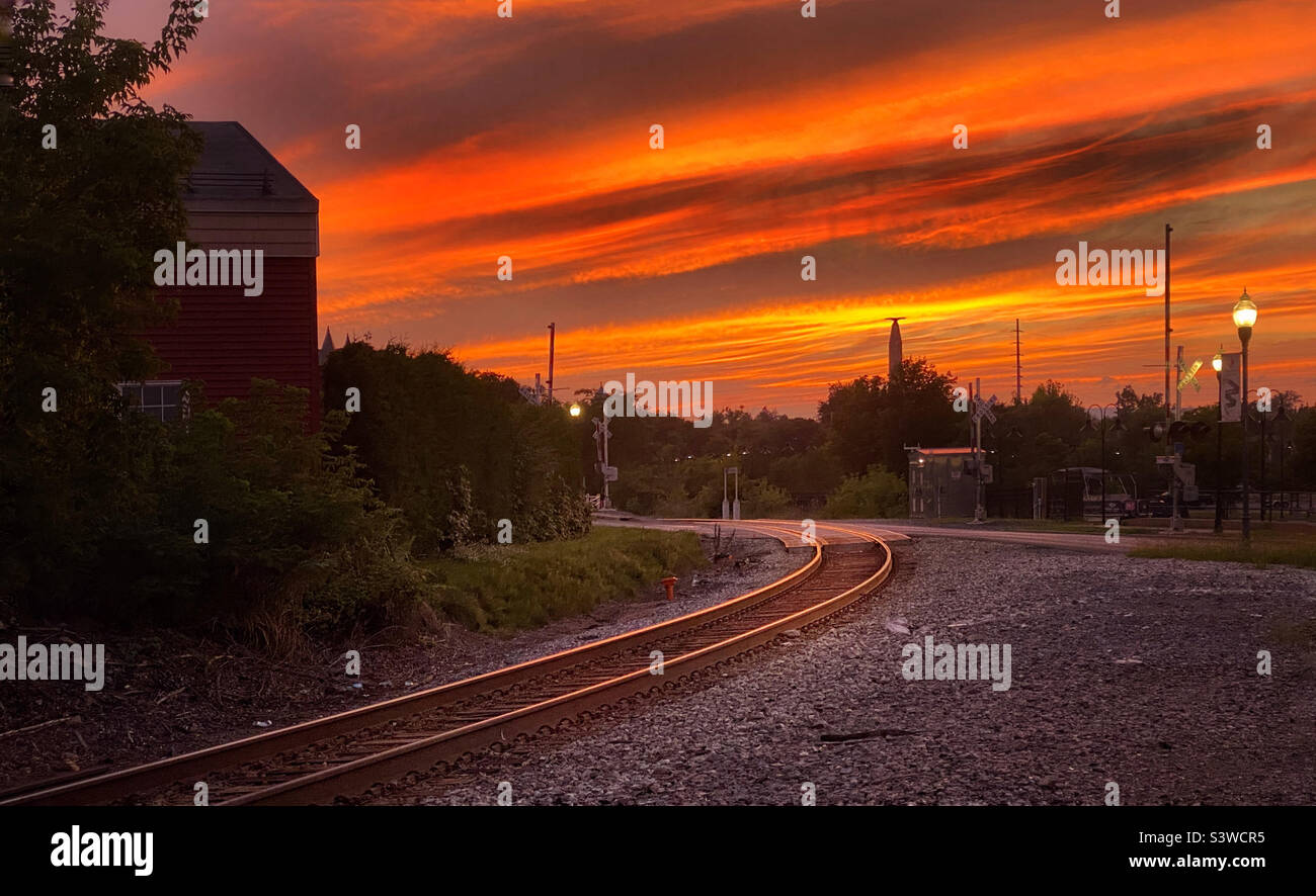 Sunset over a railroad station in Plattsburgh, a small town in northern New York State Stock Photo
