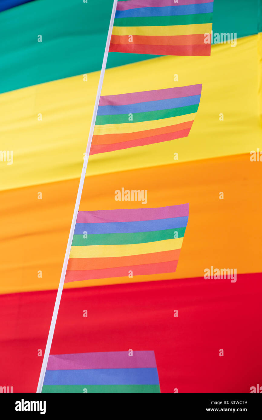 Full frame gay pride background of colourful rainbow flags and bunting during gay pride month celebrations with copy space Stock Photo