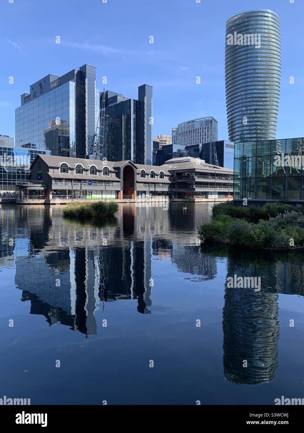 Harbour exchange in Canary Wharf London docklands reflection of buildings in water Stock Photo
