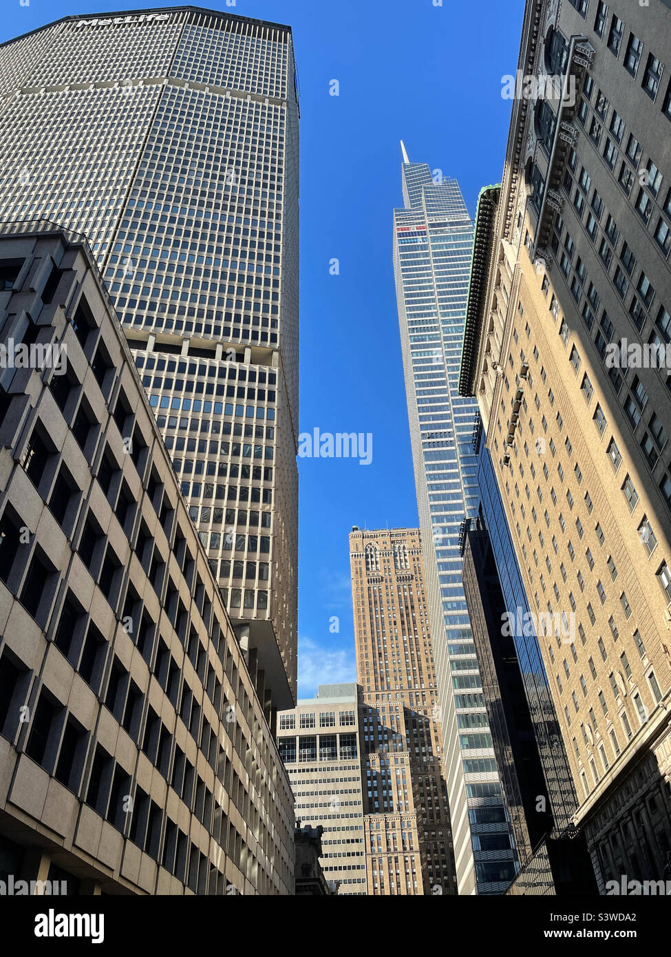 The MetLife building on one side and skyscrapers and one Vanderbilt supertall line Vanderbilt Avenue as seen from the Park Avenue viaduct, 2022, New York City, USA - Smartphone Captured Stock Image