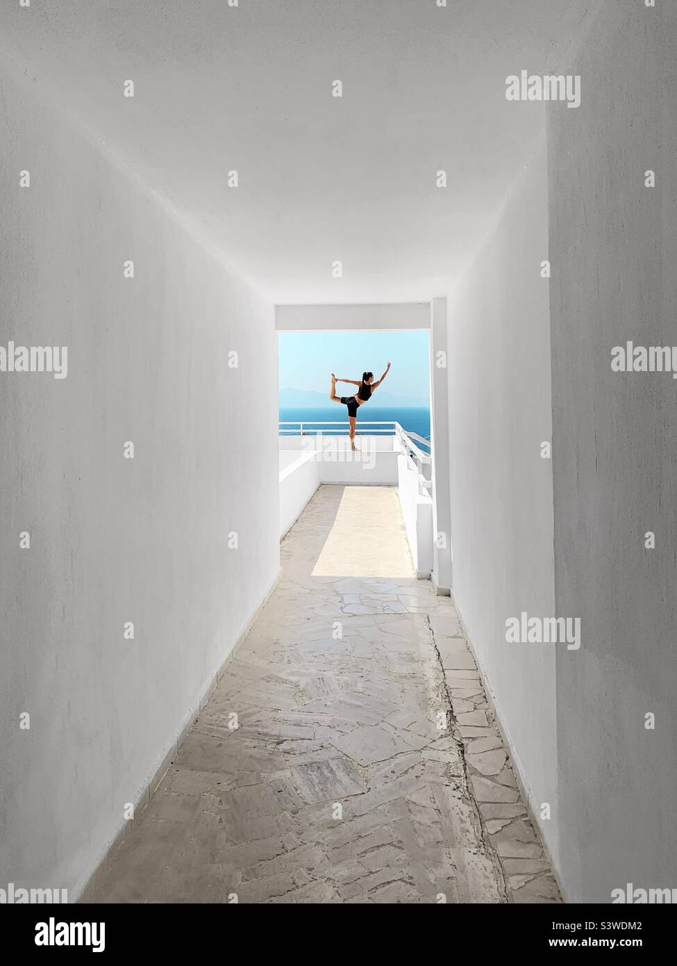 Young woman doing yoga outdoor - Smartphone Captured Stock Image