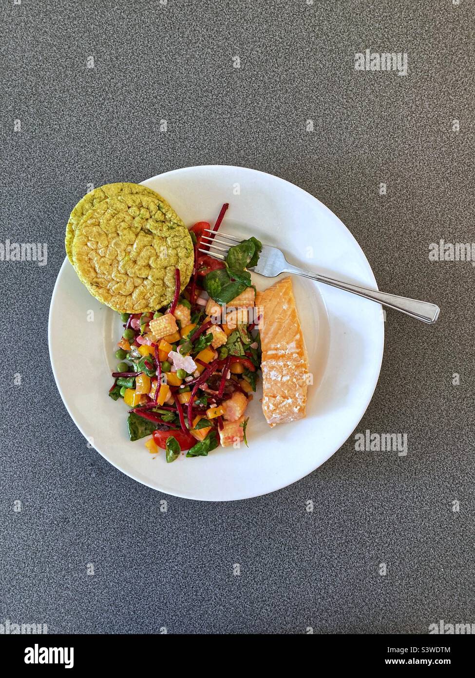 Salmon fillet, fresh salad and rice cakes - Smartphone Captured Stock Image