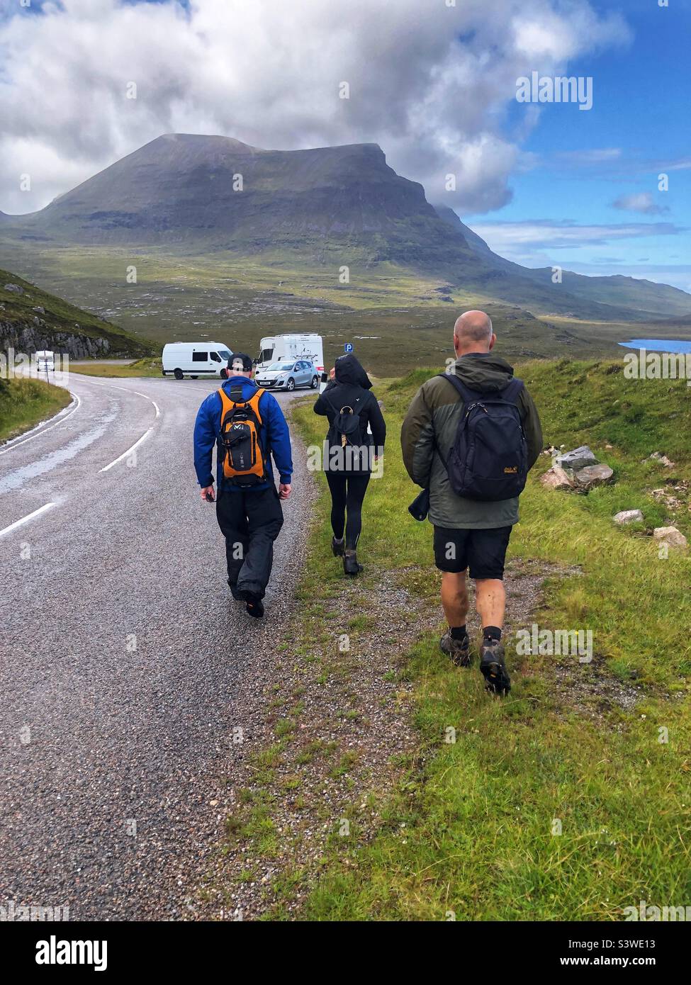Walkers returning to the car after a long walk in the rain, view of Mountain Quinag, Sutherland, Scotland - Smartphone Captured Stock Image
