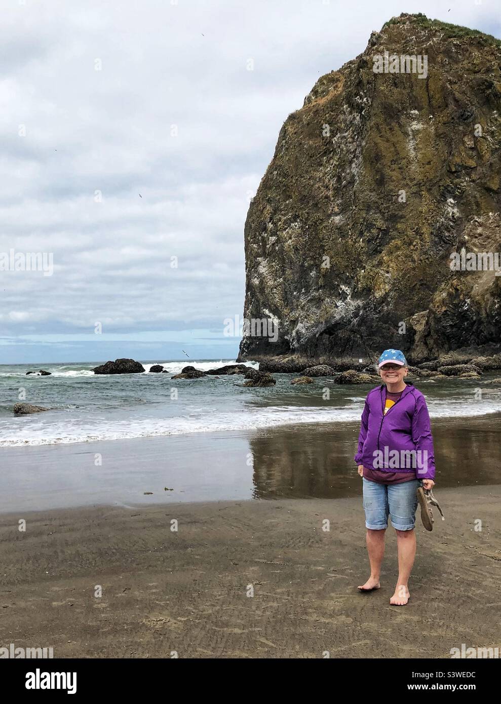 Tourist by Haystack Rock in July - Smartphone Captured Stock Image