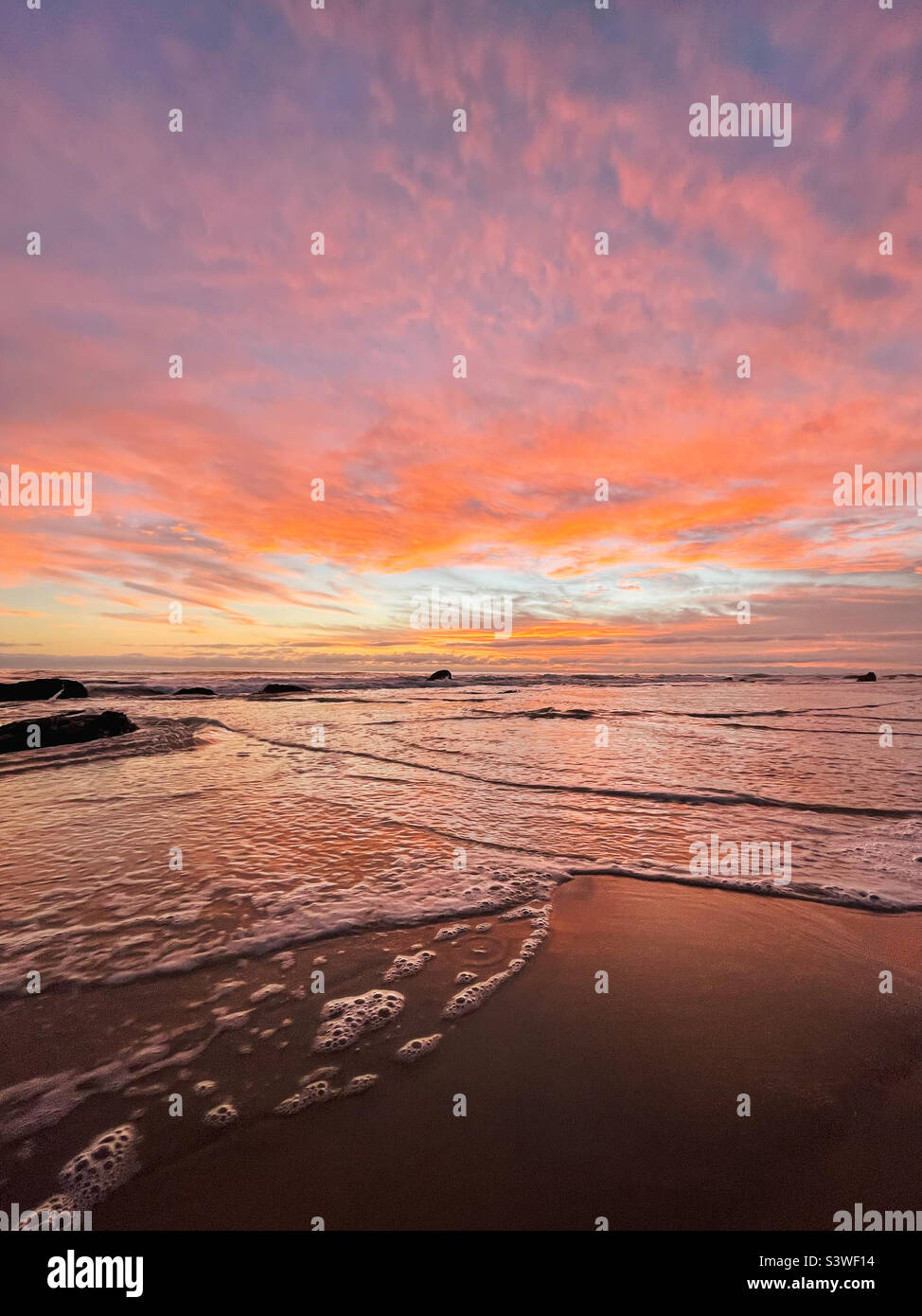 Dramatic beach sunset Stock Photo