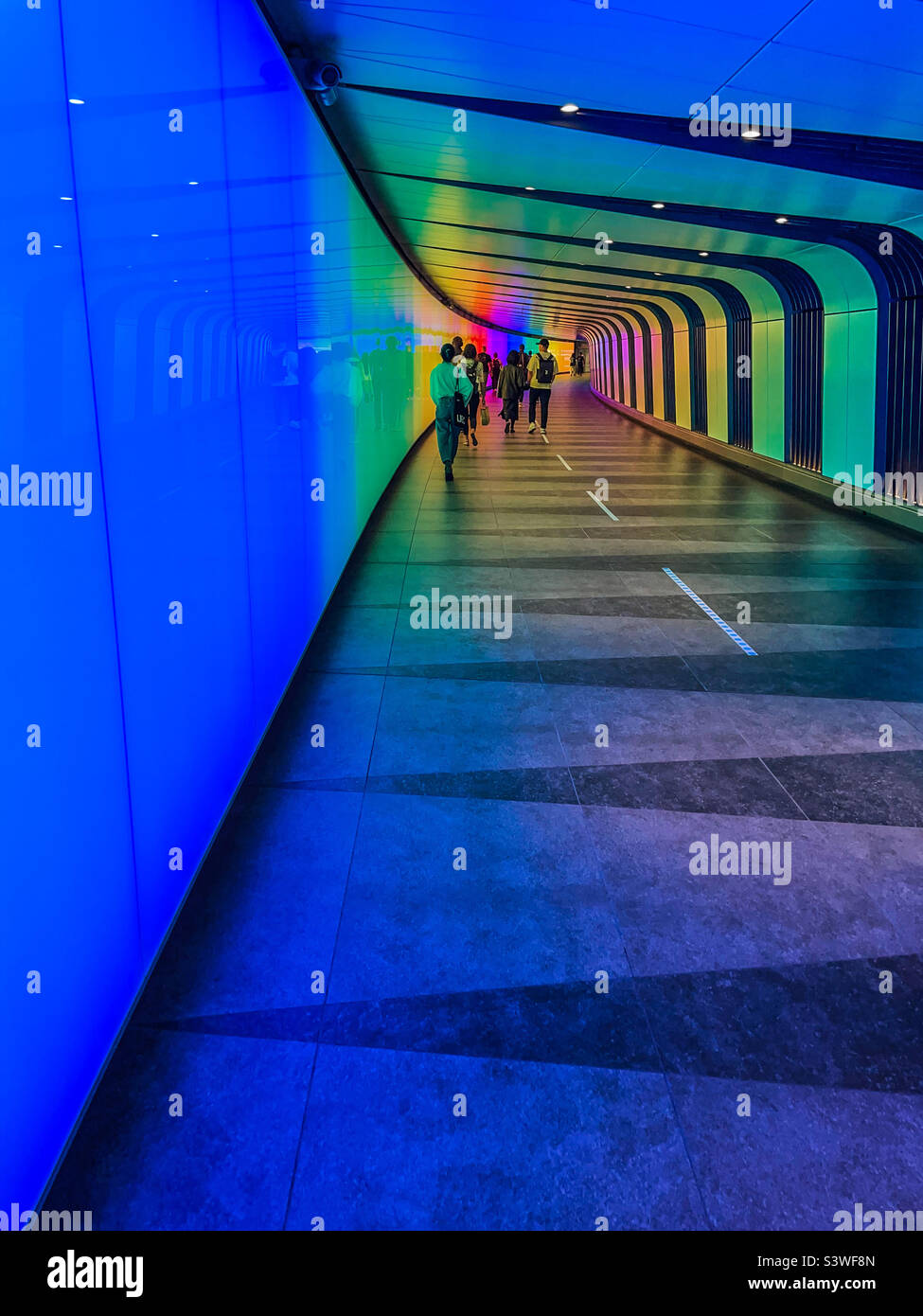 Kings Cross underground rainbow walkway Stock Photo