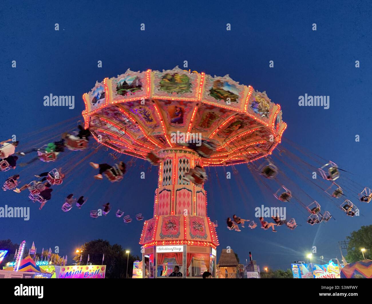 Carnival ride at a summer fair Stock Photo Alamy