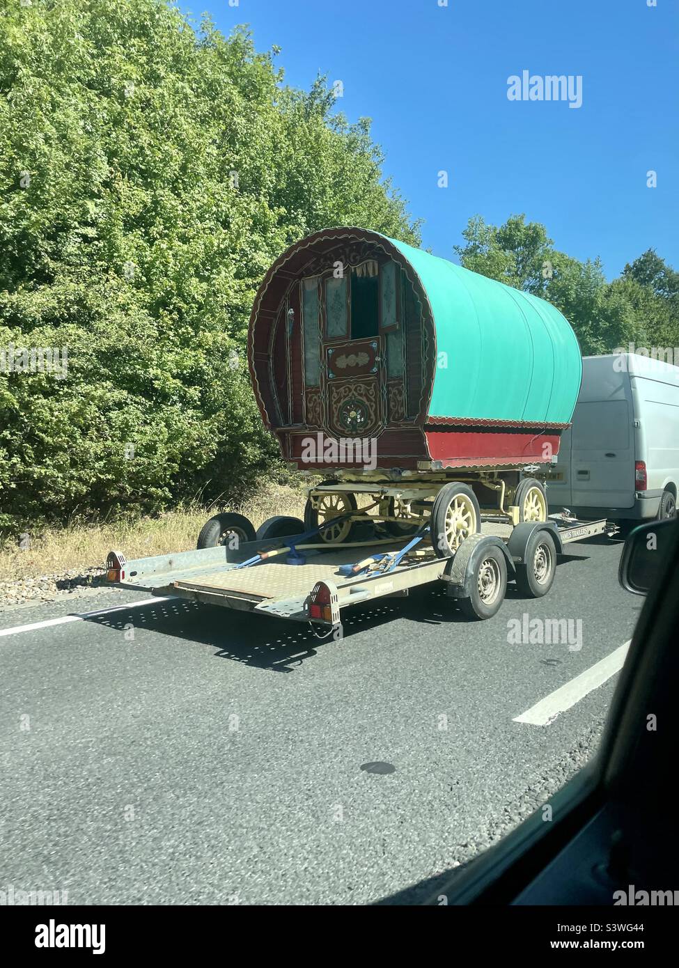 Gypsy caravan being towed on road Stock Photo Alamy