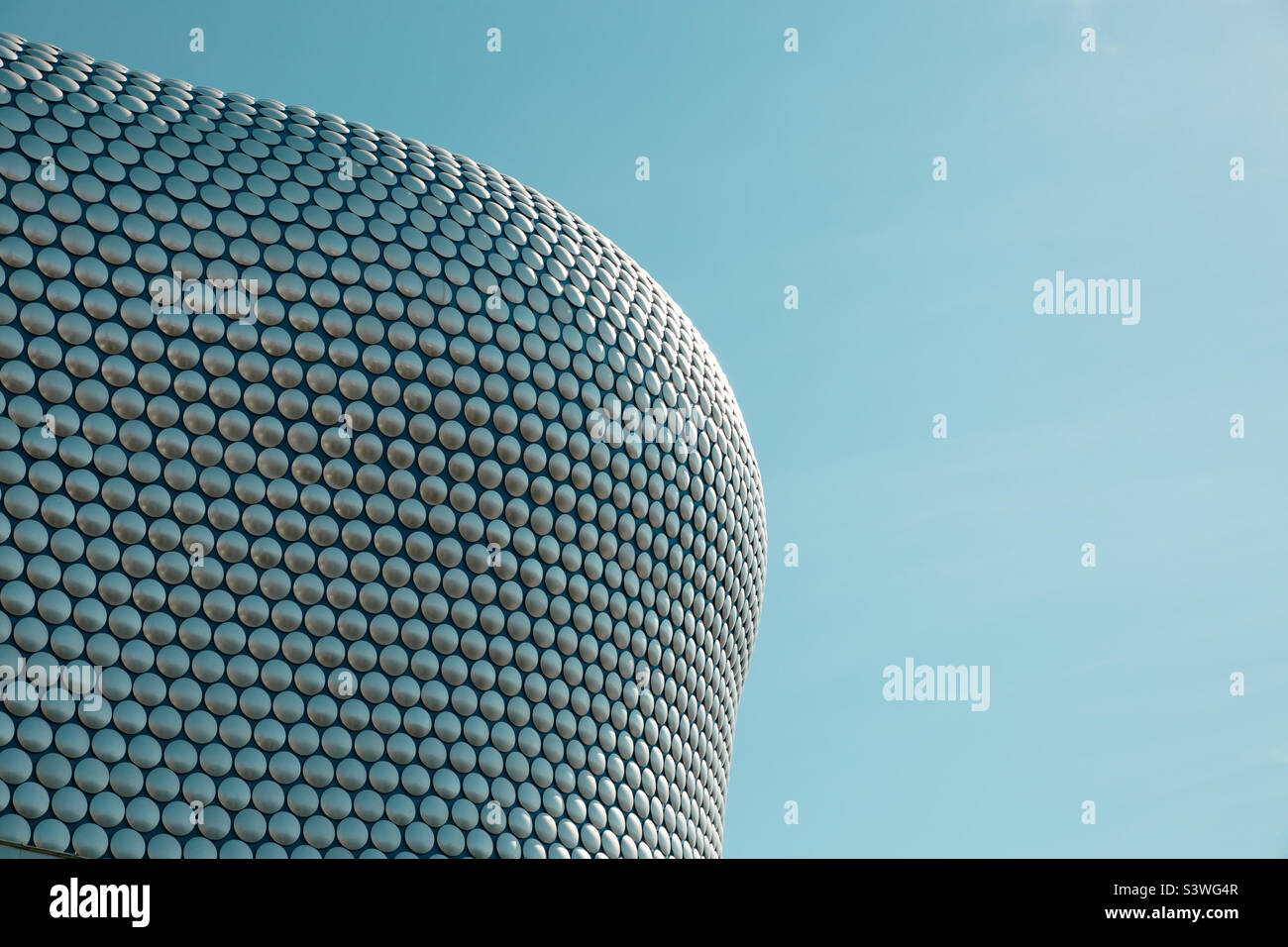 Low angle view of the aluminium discs and curved architecture of the Selfridge’s store in the boring centre Birmingham - Smartphone Captured Stock Image